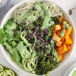 Overhead view on a vegan green nourish bowl made with roasted butternut squash.