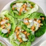 View on a few vegan buffalo chickpea lettuce wraps on a plate.