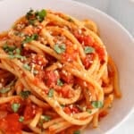 View on a bowl of bucatini pomodoro.