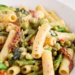 Close up on a bowl of spring vegan creamy lemon pasta.
