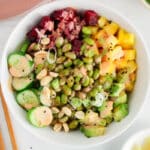 View on a vegan edamame poke bowl made with pineapple and spicy mayo.