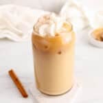 View on a tall glass of iced dirty chai latte.