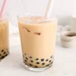Front angle view on a milk tea made dairy-free and with tapioca pearl (boba).
