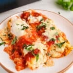 Overhead view on 2 vegan manicotti filled with a dairy-free tofu and white bean ricotta.