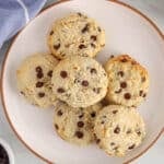Overhead view on a few almond flour banana cookies with chocolate chips on a plate.