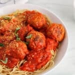 View on a bowl of vegan tofu meatball marinara with pasta.