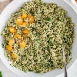 View on a large bowl of chimichurri rice topped with cherry tomatoes.