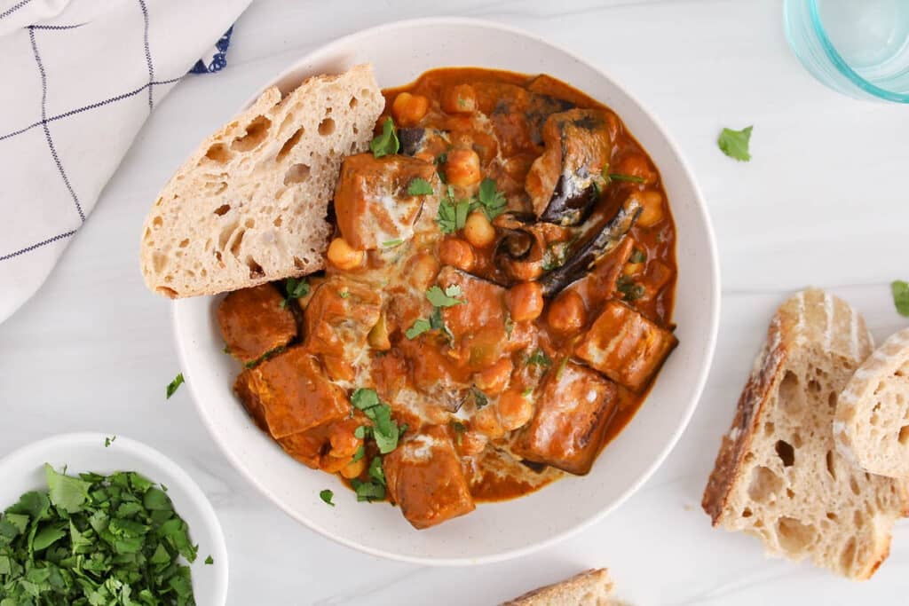 View on a bowl filled with a vegan eggplant tikka masala with chickpeas.