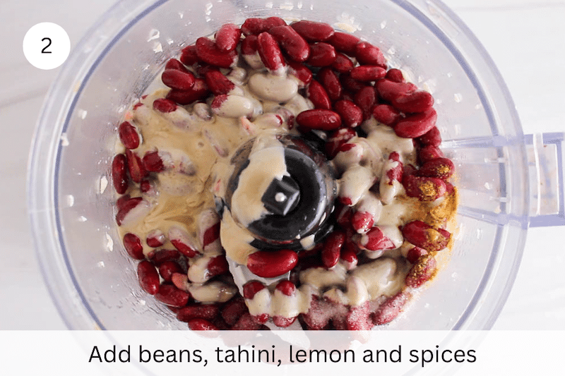 In process picture: add beans, tahini, lemon and spices.