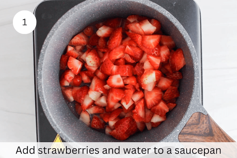 In process picture: add strawberries and water to a saucepan.