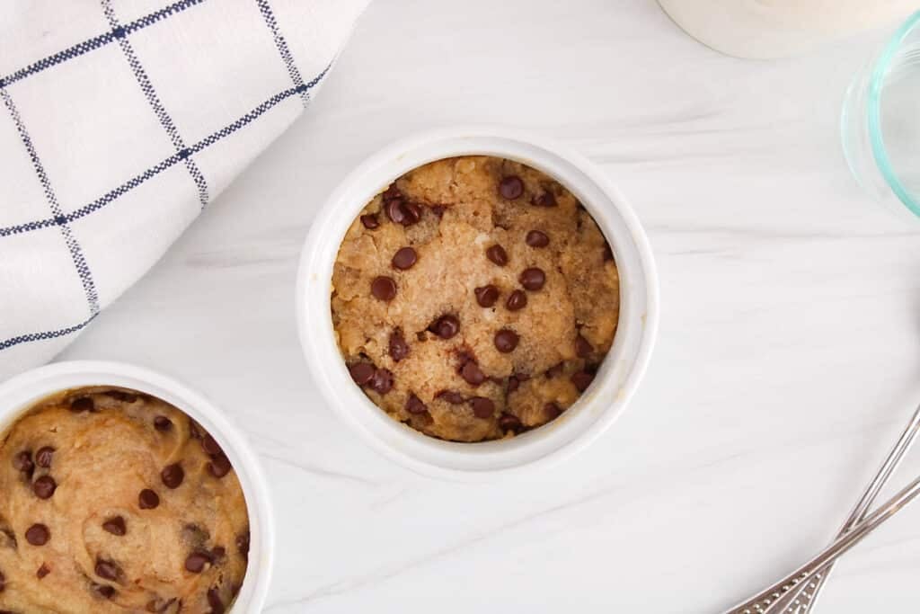 Overhead view on a vegan chocolate chip cookie in a mug.
