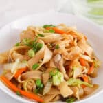 Front angle view on a bowl of Vietnamese stir-fried soy sauce noodles.
