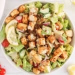 Vegan Caesar salad topped with Cajun tofu.