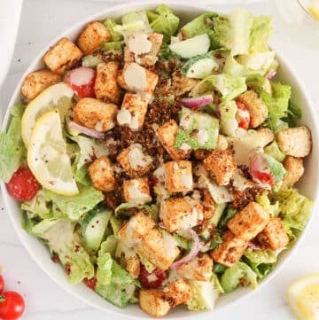 Vegan Caesar salad topped with Cajun tofu.