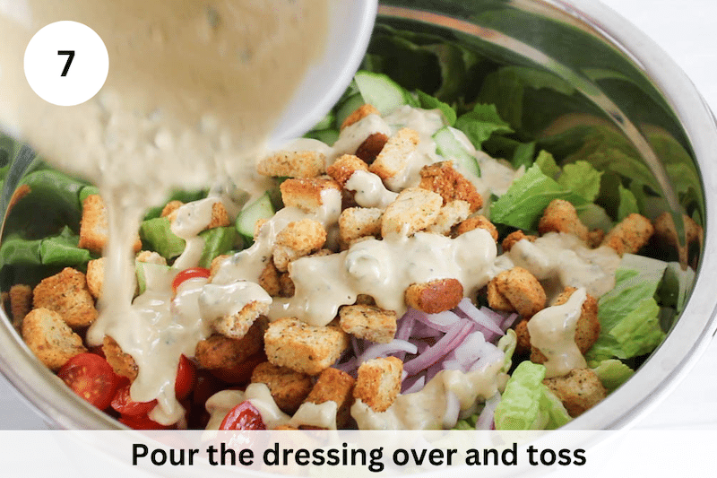 In process picture: add salad dressing over the salad.