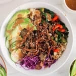 Asian buddha bowl made with marinated oyster mushrooms, avocado, cucumber and an Asian sauce.