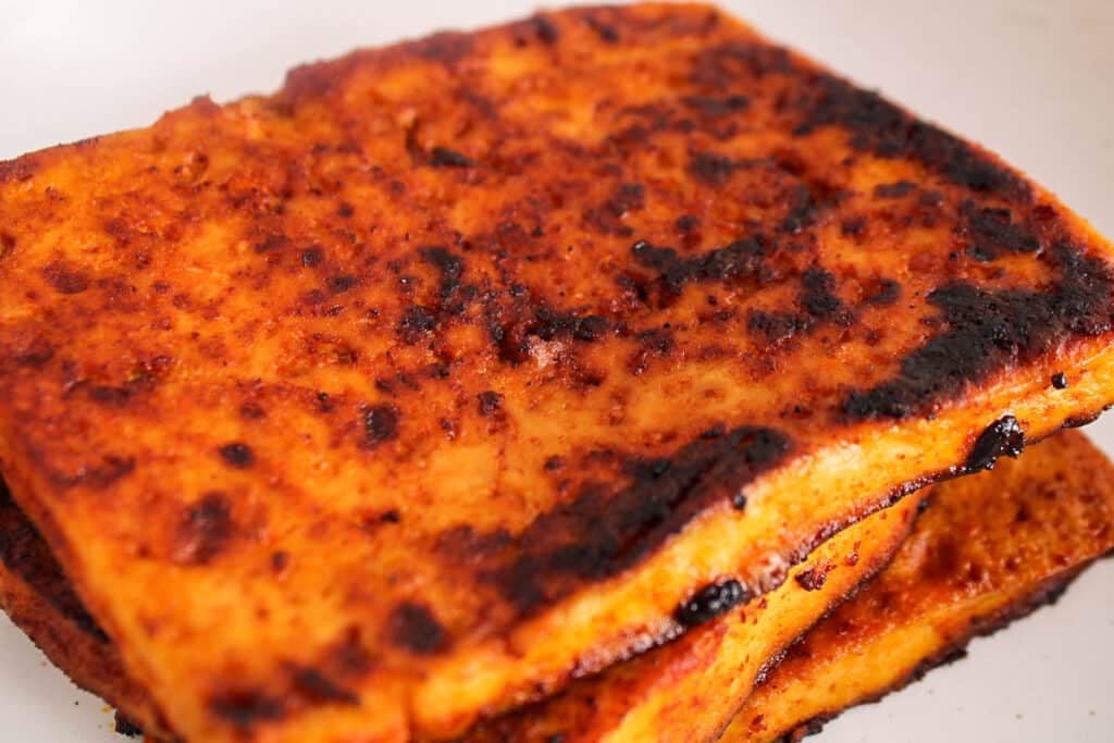 Showing the crispy edges on a few slices of tofu bacon.