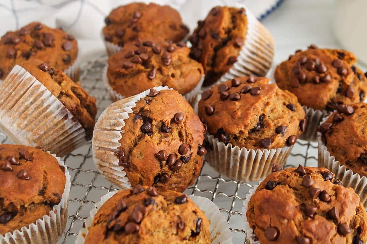 Oil-free pumpkin banana muffins on a cooling rack.