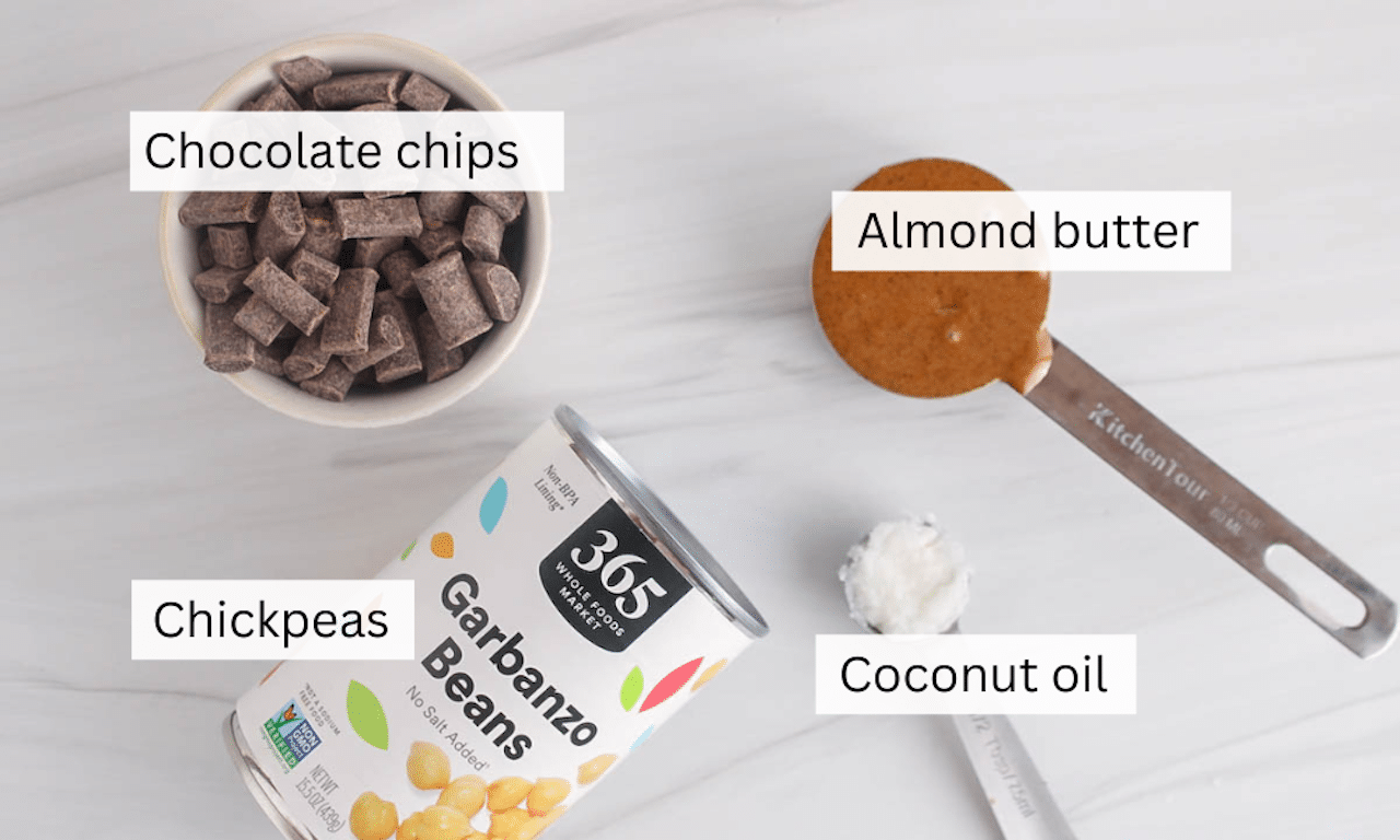 Ingredients to make chickpea truffles placed on a white table.