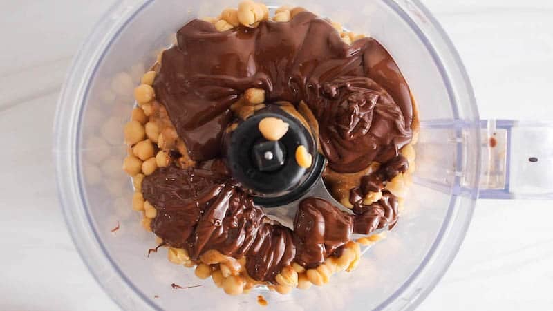 Chickpeas, chocolate and almond butter in a food processor.