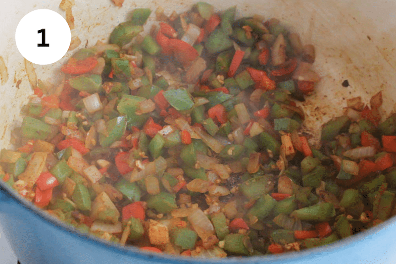 Vegetables cooking in a large pot.
