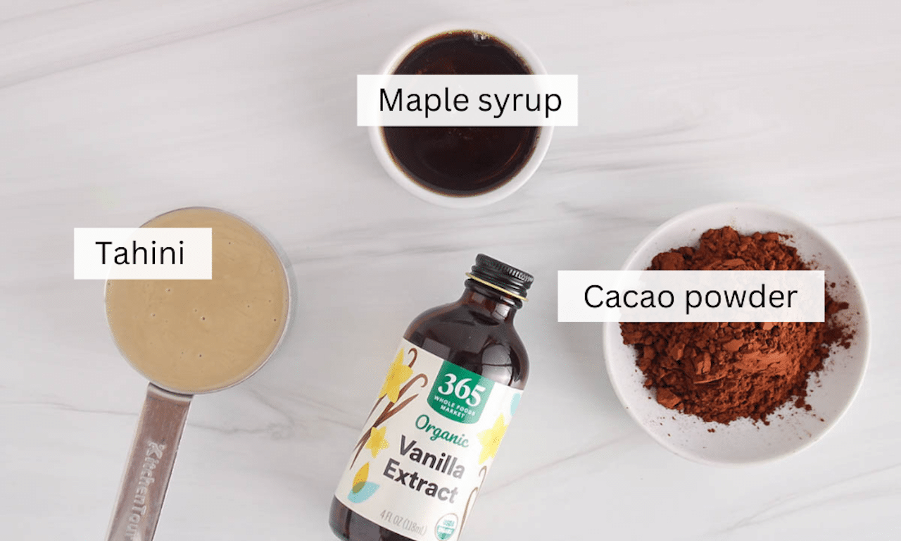Showing are the ingredients needed to make a chocolate tahini spread.
