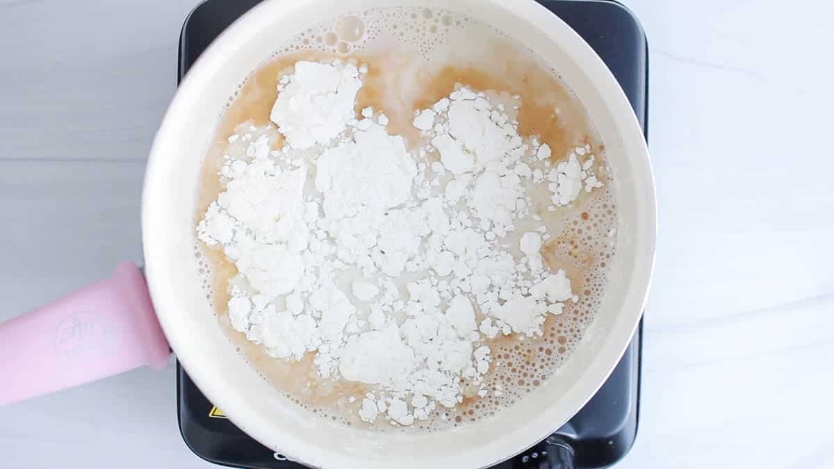 Saucepan containing plant-based milk, sweetener and cornstarch.