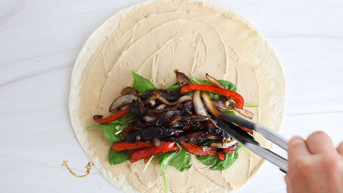 Large tortilla with hummus, spinach and portobello.