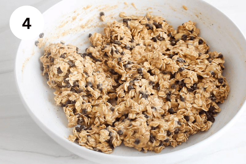 White bowl with a oatmeal cookie dough.