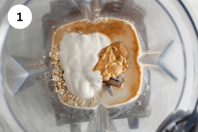 Milk, peanut butter, yogurt and oats in a blender.