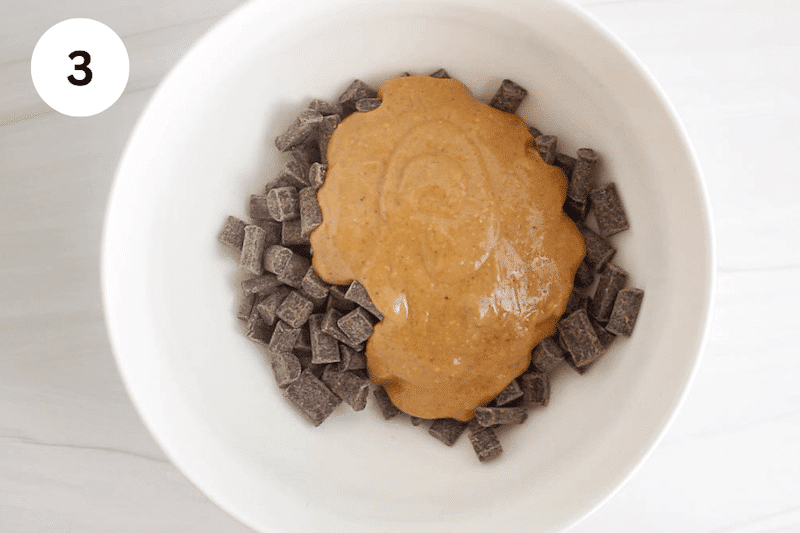 Chocolate chunks and peanut butter in a bowl.
