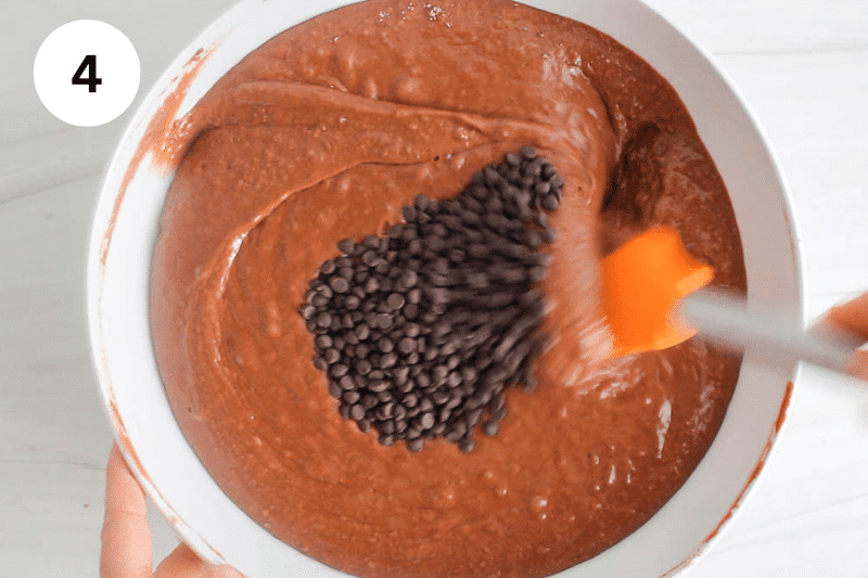 A chocolate cake batter topped with chocolate chips.