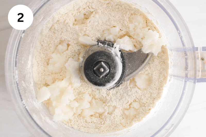 Food processor with flour and coconut oil.
