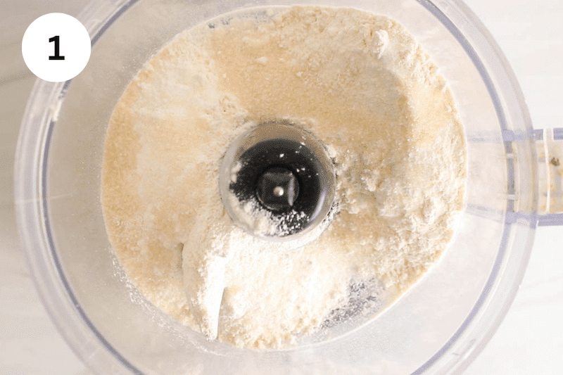 Food processor with flour, salt and sugar.