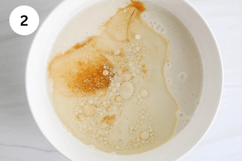 A milk mixture with oil in a mixing bowl.
