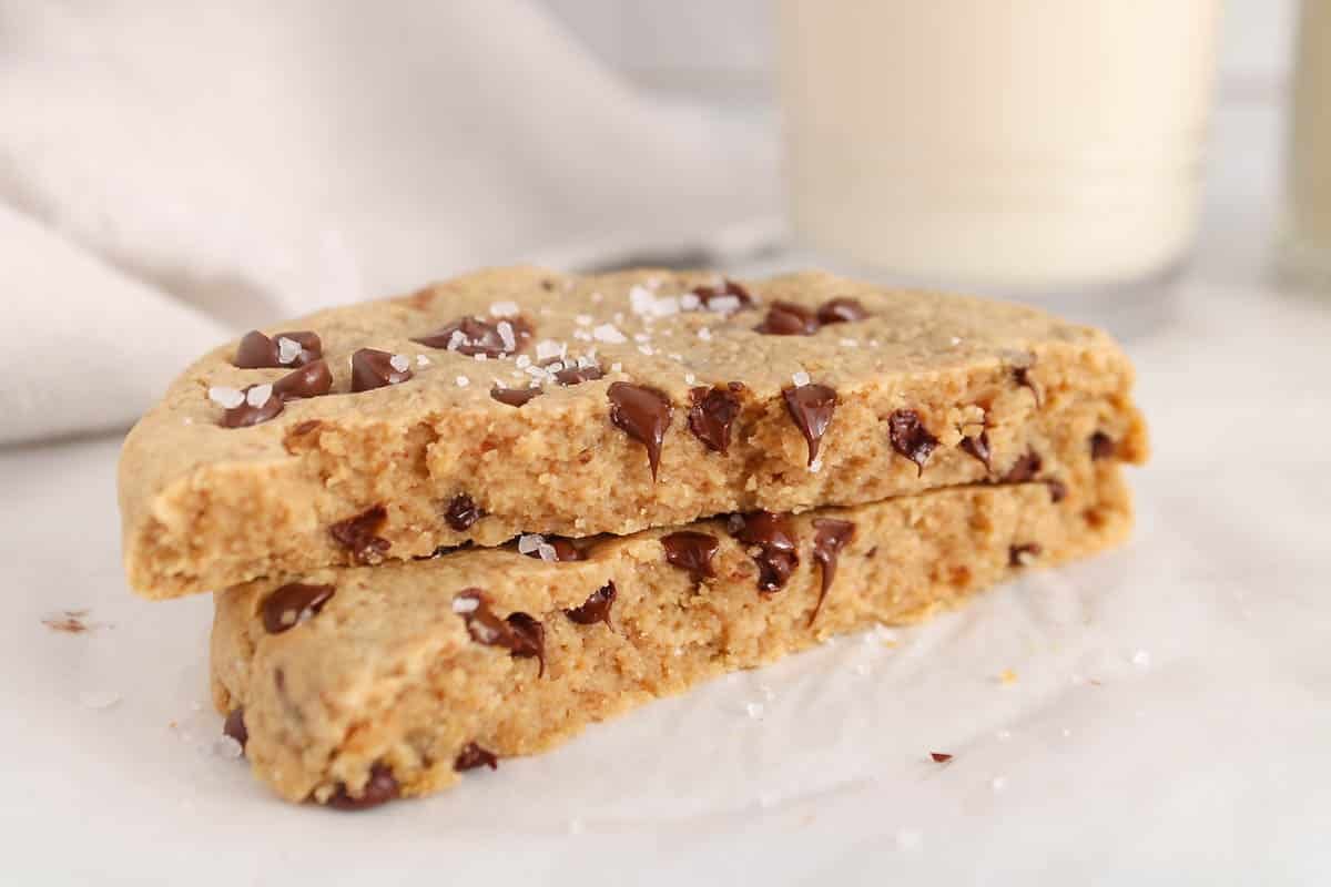 A single serve protein cookie sliced in half.