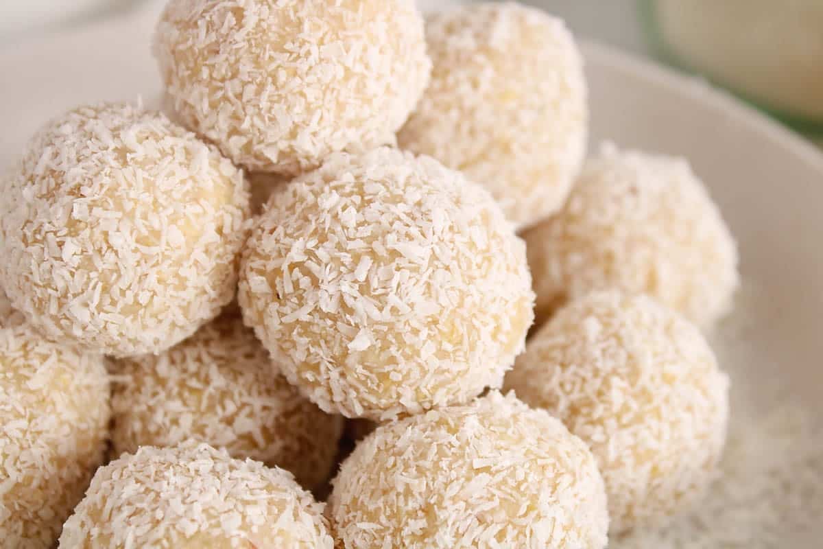Lemon bliss ball covered with shredded coconut.