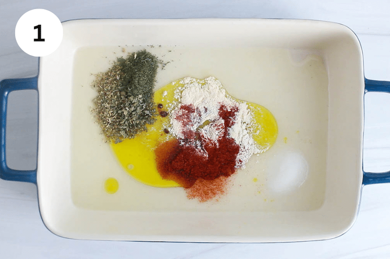 Large container with lemon juice and spices.