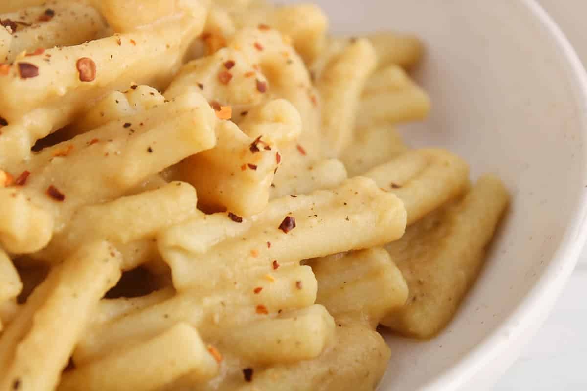 Short noodles covered with a vegan chickpea pasta sauce.