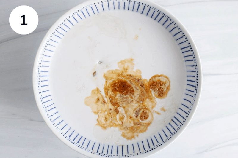 A bowl filled with coconut milk, sugar and vanilla.