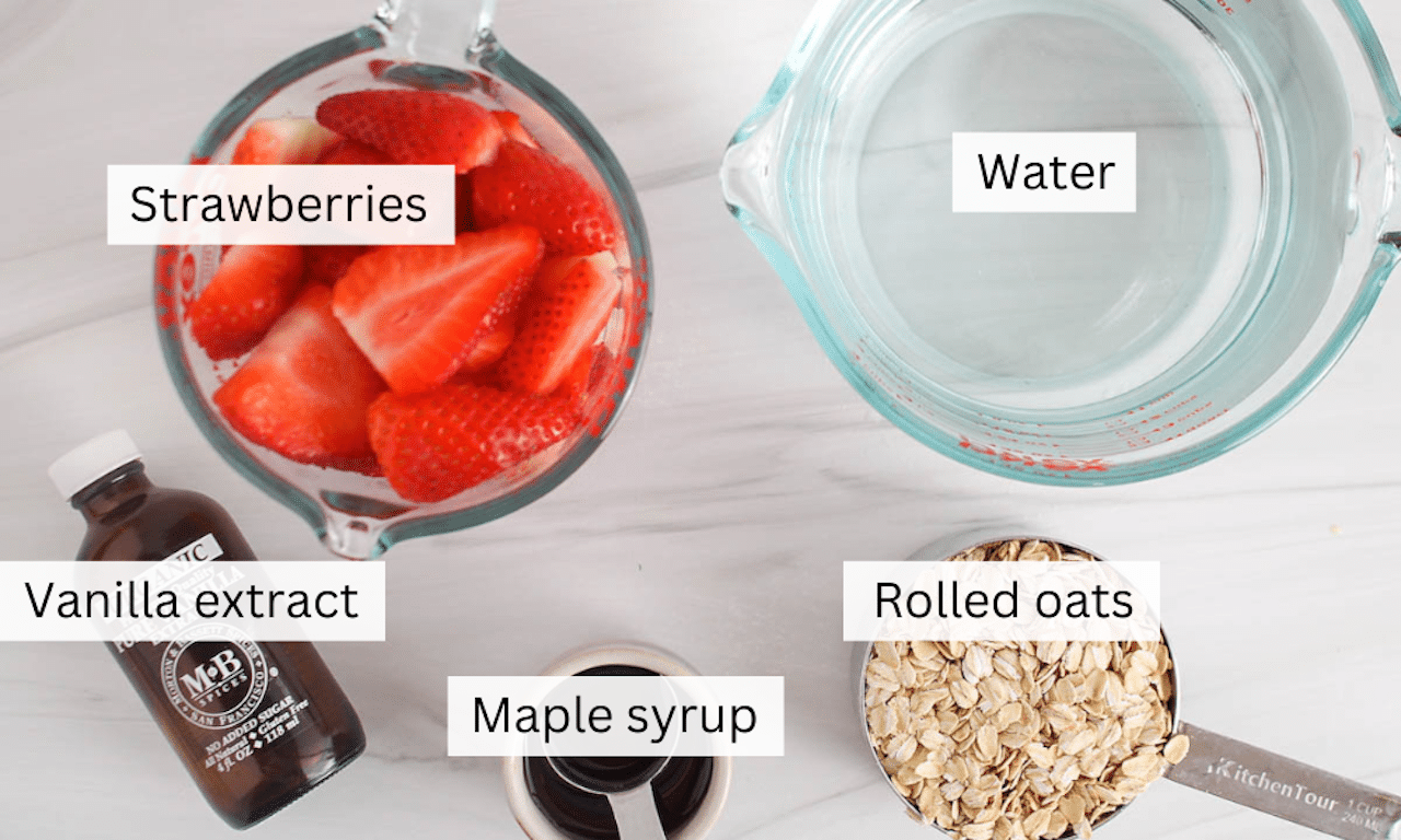 Ingredients needed to make homemade strawberry oat milk placed on a white table.
