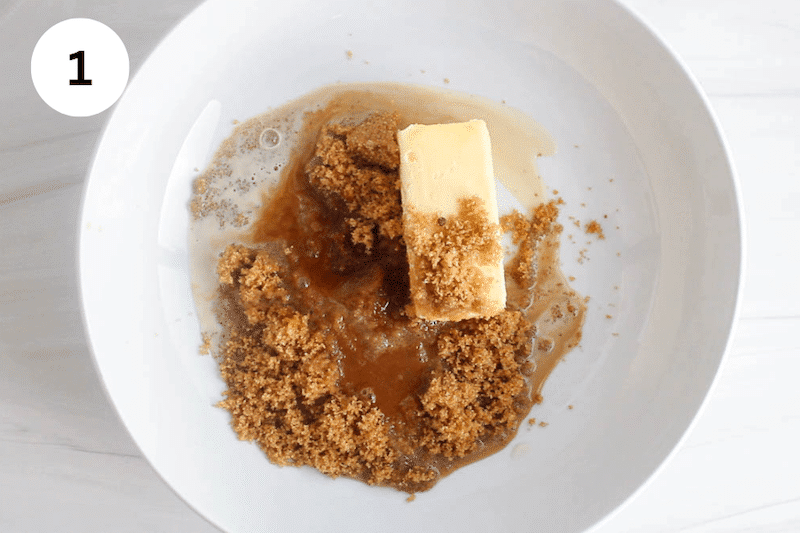 A stick of vegan butter with oat milk, brown sugar and vanilla in a large white bowl.