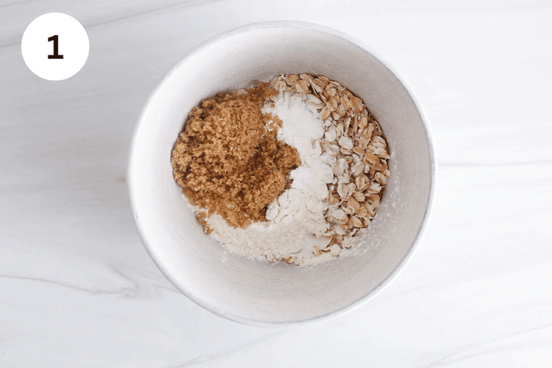 Flour, brown sugar and oats in a bowl.