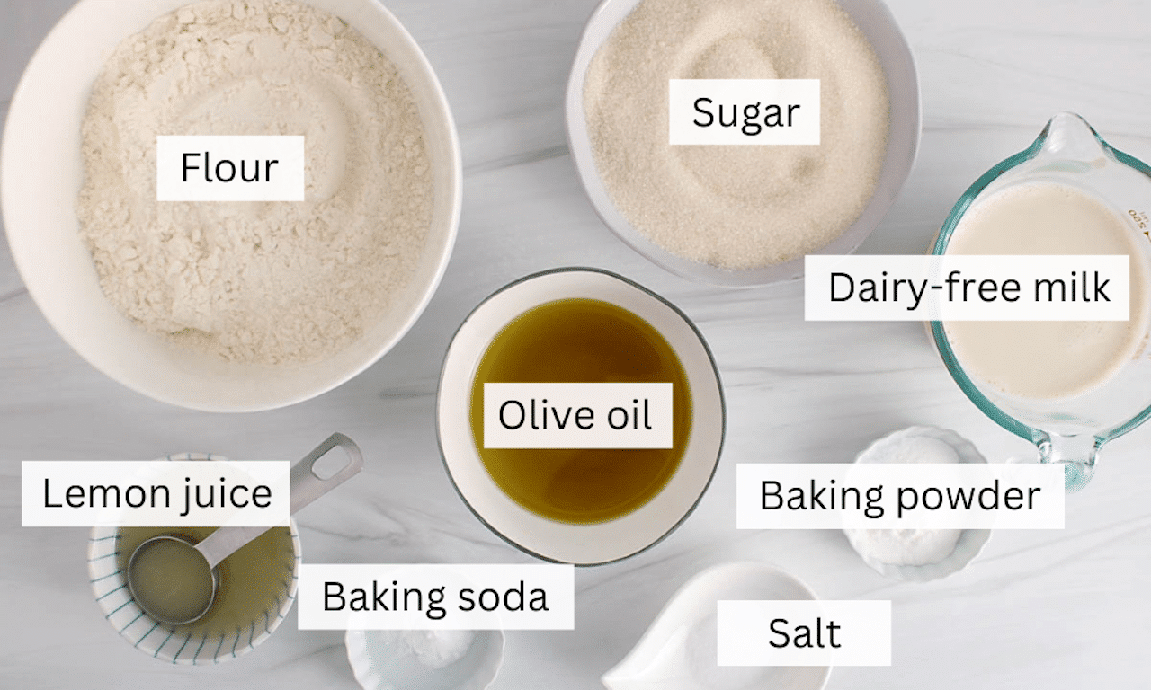 Showing are the ingredients needed to make a vegan olive oil cake.