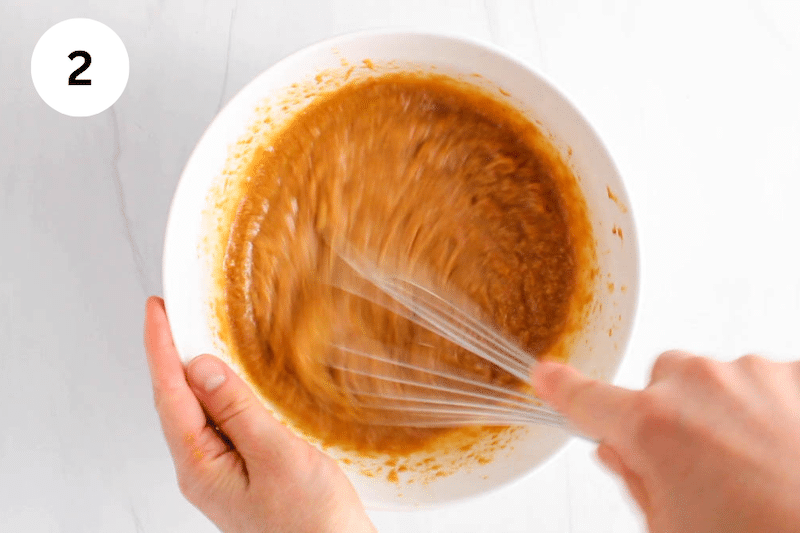 Whisking the ingredients.