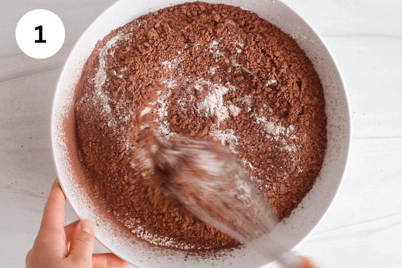 Large white bowl with flour and cacao powder.