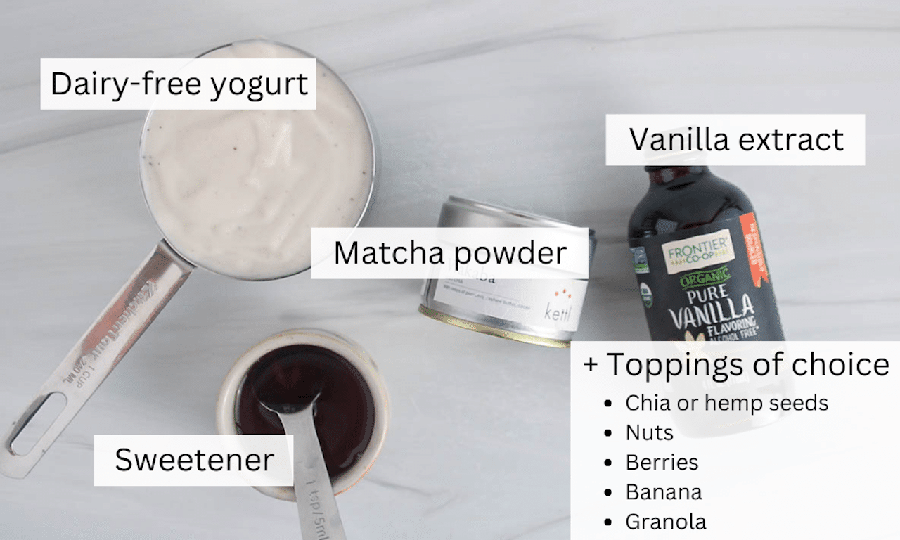 Ingredients to make matcha yogurt bowl on a white table.