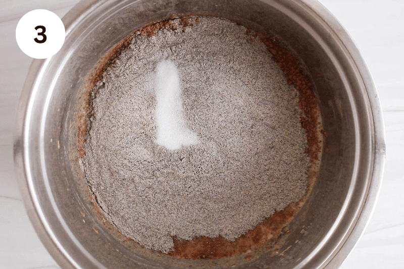 A mixing bowl with buckwheat flour and over a wet mixture.