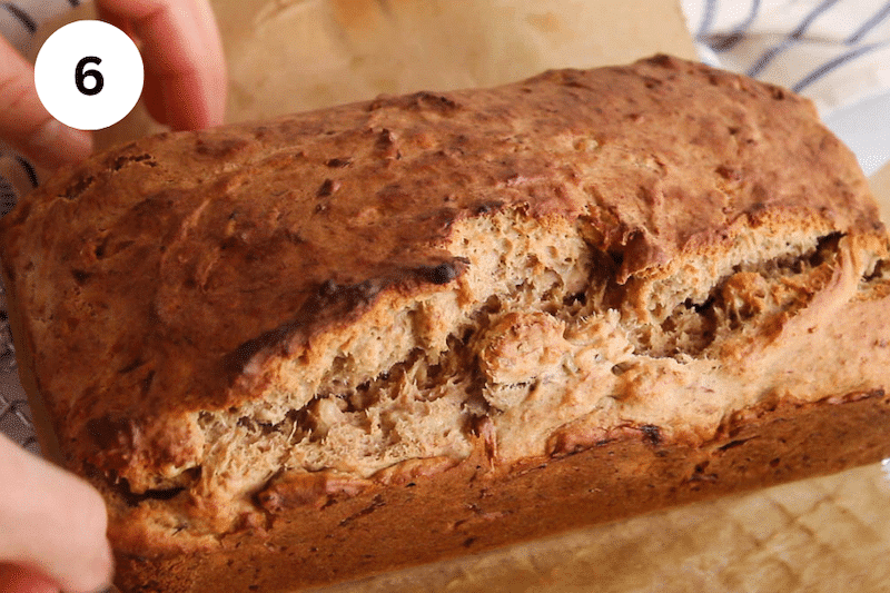 A banana bread on parchment paper.