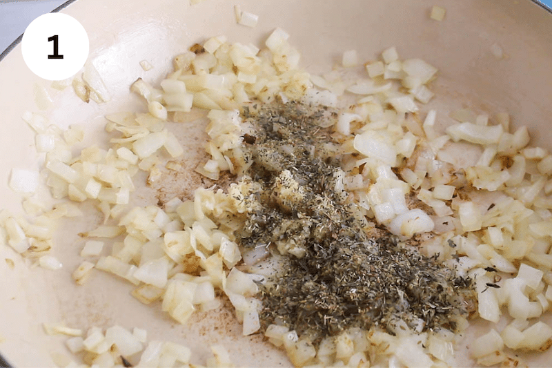 Large pan with onions and aromatics.